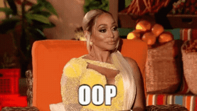 Woman In Yellow Dress Sitting In Orange Chair GIF