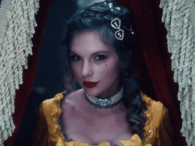 Woman In Yellow Dress With Heart Necklace GIF