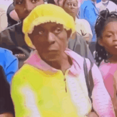 Woman In Yellow Hat And Pink Sweater GIF