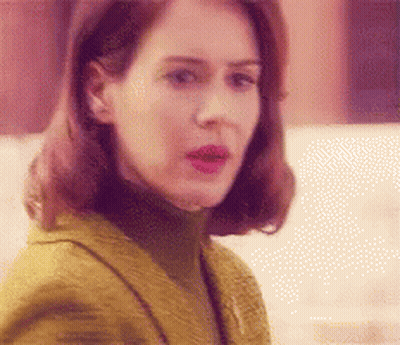 Woman In Yellow Jacket And Turtleneck GIF
