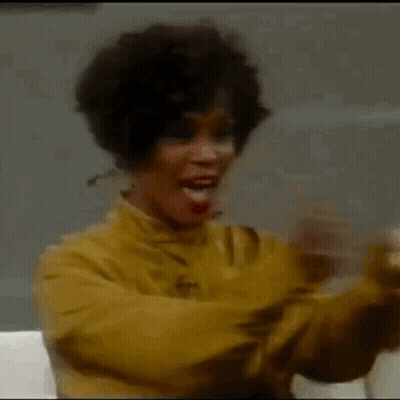 Woman In Yellow Jacket Applauding GIF