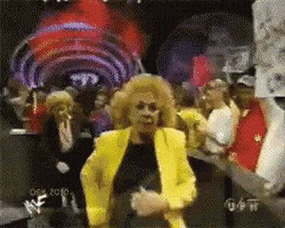 Woman In Yellow Jacket Dancing At Wrestlemania GIF