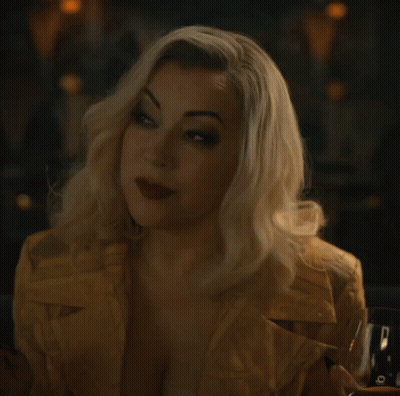 Woman in Yellow Jacket Holding Glass