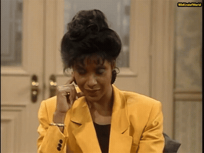 Woman In Yellow Jacket Talking On Cell Phone 80Skindofworld GIF