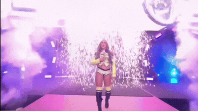 Woman In Yellow Jacket Walking Down Stage GIF