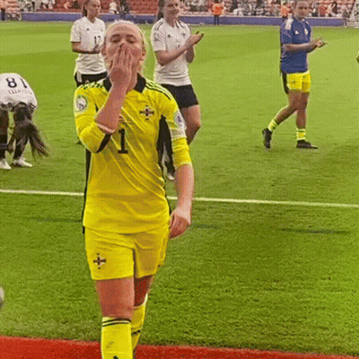 Woman In Yellow Jersey Number 1 On Soccer Field GIF