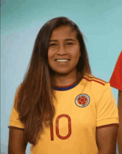 Woman in Yellow Jersey Number 10 Smiles
