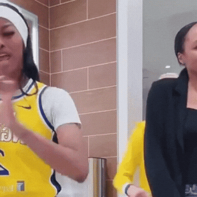Woman In Yellow Jersey Number 2 Dancing GIF