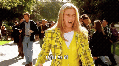 Woman In Yellow Plaid Jacket Shouting To Crowd GIF