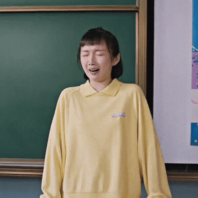 Woman In Yellow Rainbow Sweatshirt GIF