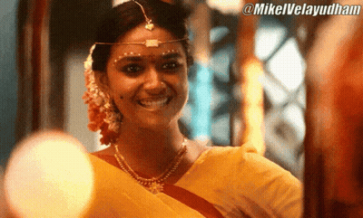 Woman In Yellow Sari Smiling At @Mikelvelayudham Sign GIF