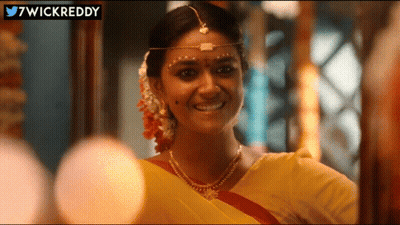 Woman In Yellow Sari Smiling With 7Wickreddy GIF