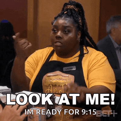 Woman In Yellow Shirt And Black Apron Saying Look At Me GIF