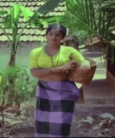 Woman In Yellow Shirt And Purple Skirt GIF