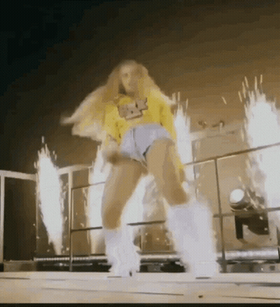 Woman In Yellow Shirt And Shorts Dancing GIF