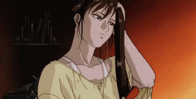 Woman In Yellow Shirt Brushing Hair GIF