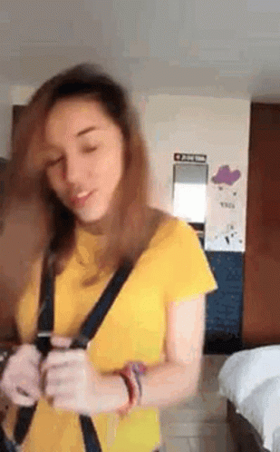 Woman In Yellow Shirt Holding Cell Phone GIF