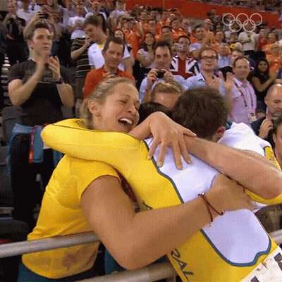 Woman In Yellow Shirt Hugging Man In White With 2X GIF