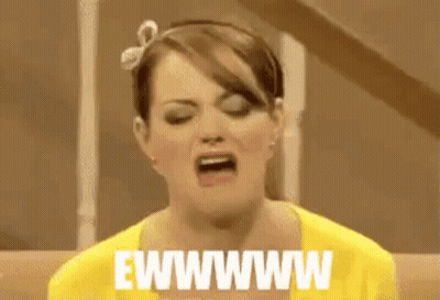 Woman In Yellow Shirt Making Funny Face GIF