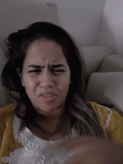 Woman In Yellow Shirt Making Funny Face GIF
