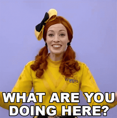 Woman In Yellow Shirt Saying Wiggles Asking What Are You Doing Here GIF