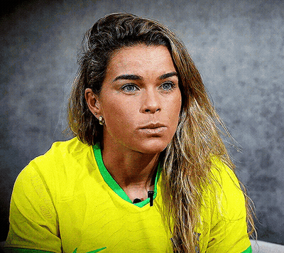 Woman In Yellow Shirt With Green Trim GIF