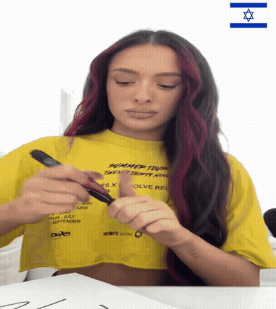 Woman In Yellow Summer Tour Shirt GIF