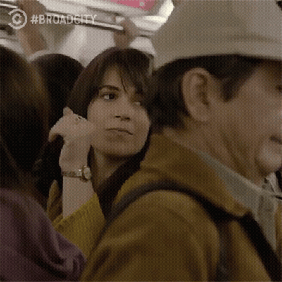 Woman In Yellow Sweater On Train GIF