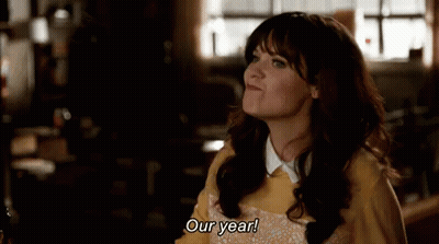Woman In Yellow Sweater Saying Our Year Looking Up GIF