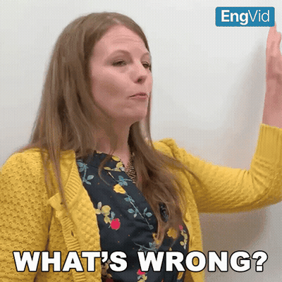 Woman In Yellow Sweater Says Whats Wrong GIF