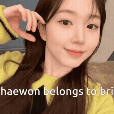 Woman in Yellow Sweater Taking Selfie Haewon Belongs to Bri
