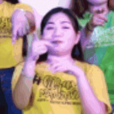 Woman In Yellow T-Shirt Making Funny Face GIF