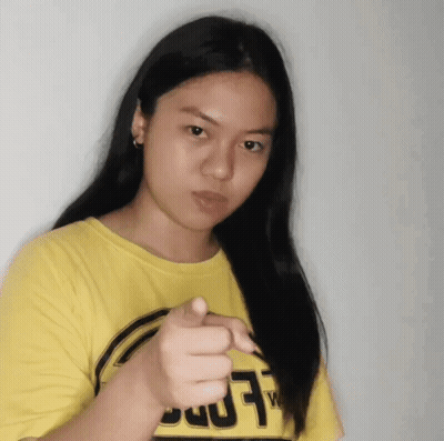 Woman In Yellow T-Shirt With Letter T Pointing GIF
