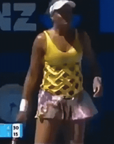 Woman In Yellow Tank Top And Pink Skirt Standing In Front Of Sign Saying 30 15 GIF