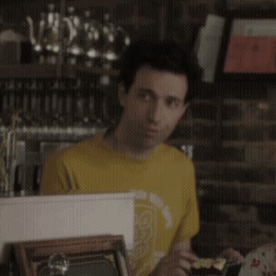 Woman In Yellow Tank Top Sitting With Man GIF