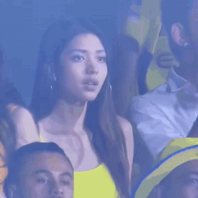 Woman In Yellow Tank Top Watching Game GIF