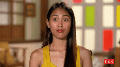 Woman In Yellow Tank Top With TLC Logo GIF