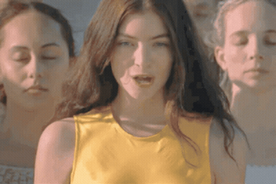 Woman In Yellow Tank Top With Two Others GIF