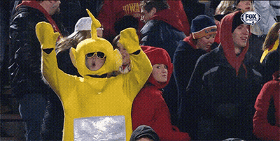 Woman In Yellow Teletubbies Costume In Crowd Watching Fox Sports Game GIF