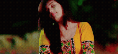 Woman In Yellow Top And Earrings Looking Up At Sky GIF