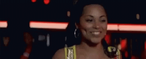 Woman In Yellow Top Smiling GIF