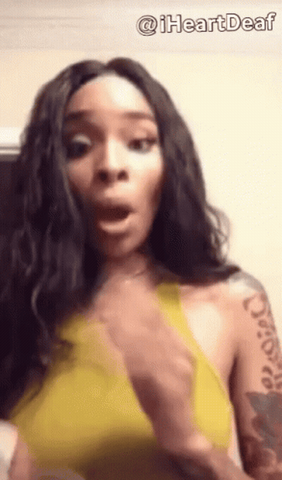 Woman In Yellow Top With Arm Tattoo GIF
