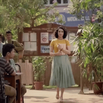 Woman In Yellow Walking National College Of Technology GIF