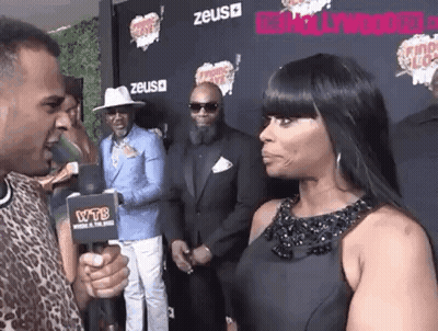 Woman Interviewed By Man With Microphone GIF