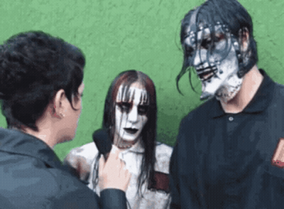 Woman Interviewing Man And Woman With Mask GIF