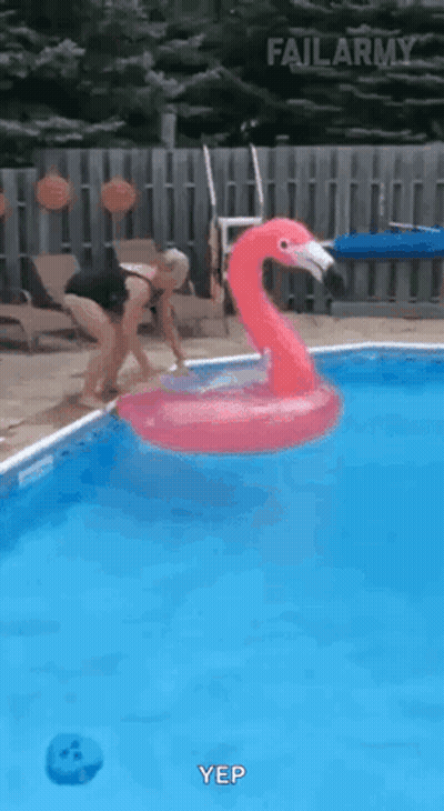 Woman Jumping Into Pool With Flamingo Float GIF