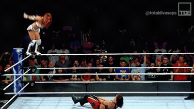 Woman Jumping Over Man In Wrestling Ring GIF