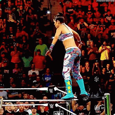 Woman Jumping Over Wrestling Ring GIF