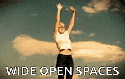 Woman Jumping With Wide Open Spaces GIF