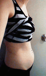 Woman Keeps Track Of Pregnant Belly Bump GIF